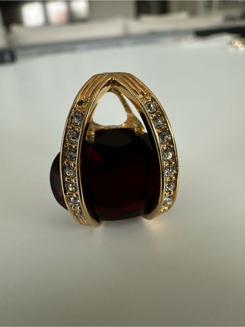 Gold-Tone Pendant with Deep Red Center Stone and Crystal Accents